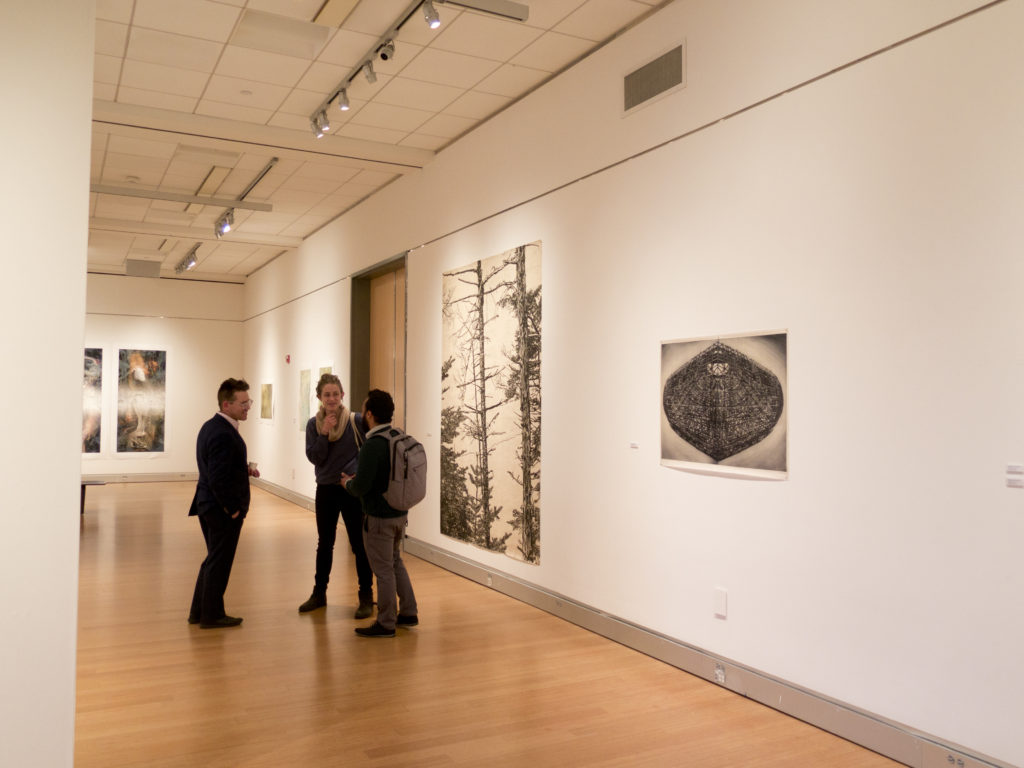View of several works, Jenny Robinson's prints pictured at right